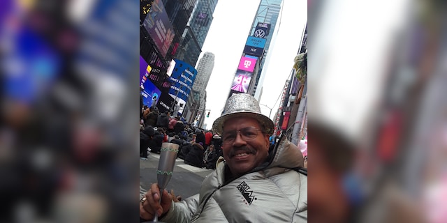 Ronald Colbert celebrates New Year's Eve in Times Square in Manhattan on December 31, 2019. As a longtime celebrant, he's hoping to return to the field to watch the ball drop for the last time.